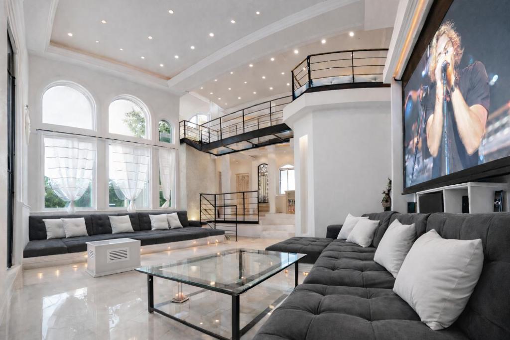 a living room with a couch and a glass table at Mansion Mauresque in Playa del Carmen