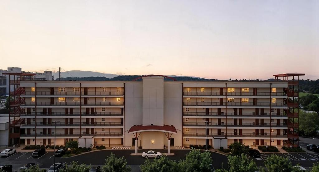 a building with a parking lot in front of it at New 2 Bed 2 Bath Condo with Pool at BMS in Bristol