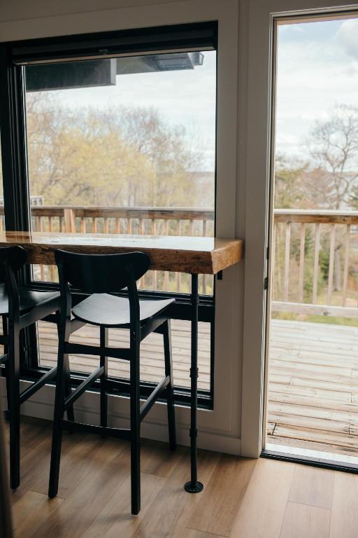 a table and chairs in front of a window at Outbounder in Bayfield