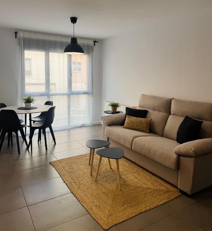 a living room with a couch and a table at El Sueño De Albarracín IV in Albarracín