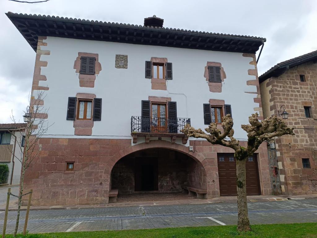 an external view of a building with a courtyard at TXARRENEA in Elizondo