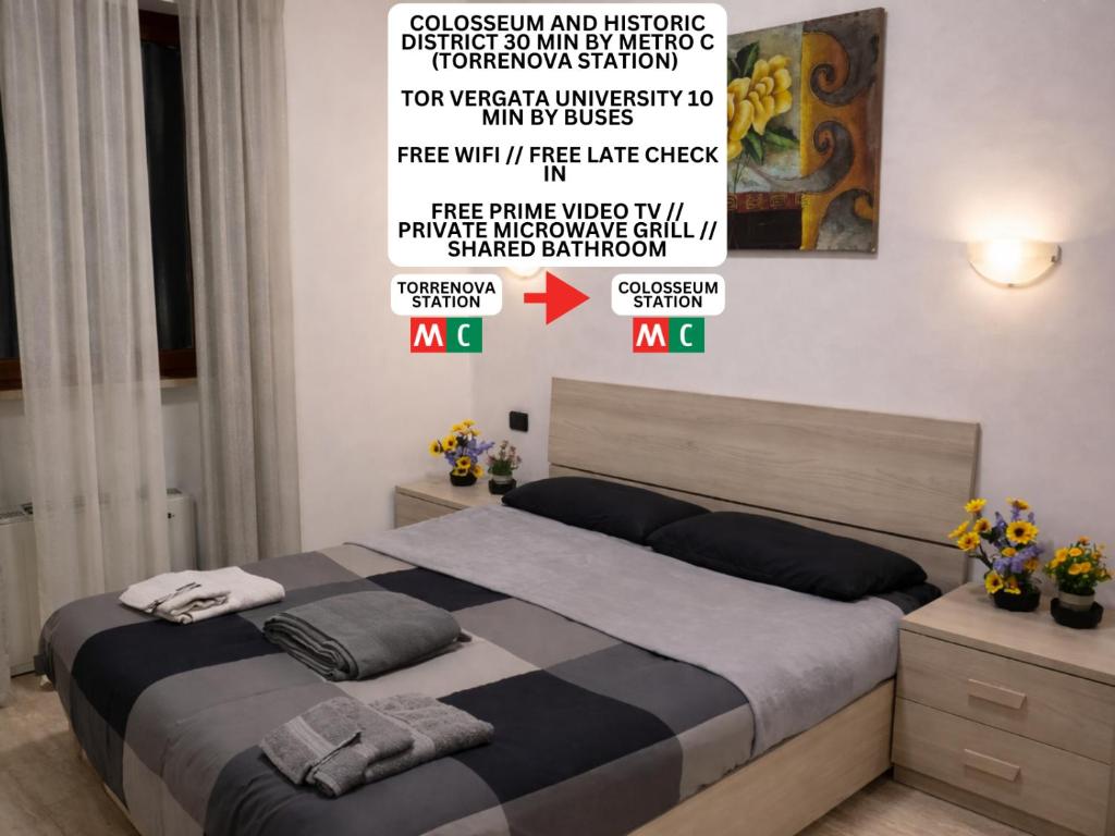 a bedroom with a bed with a poster on the wall at Golden Stay Rome - Golden Room - Close to Metro C in Tor Vergata