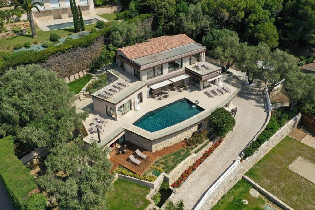 an aerial view of a house with a swimming pool at Villa Paulina MOUGINS in Mougins