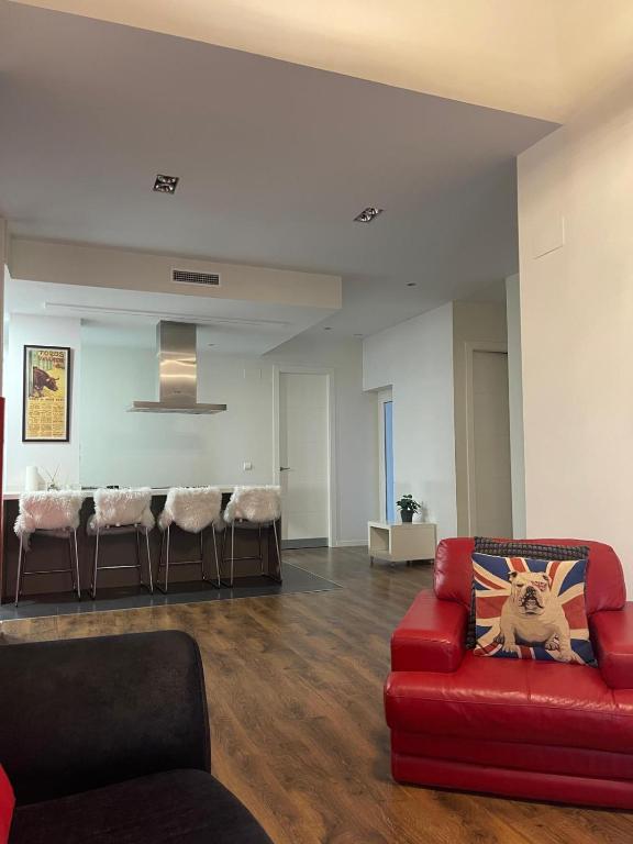 a living room with a red couch and chairs at Total Valencia Elegance in Valencia