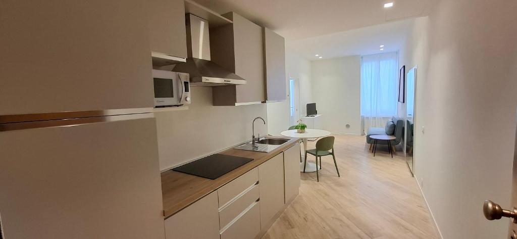 a kitchen with a sink and a counter top at Casa Mafalda in Torre Boldone