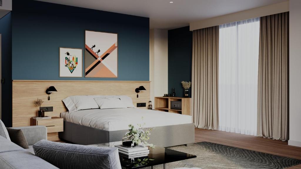 a bedroom with a large bed and a couch at Spark By Hilton Van City Centre in Van