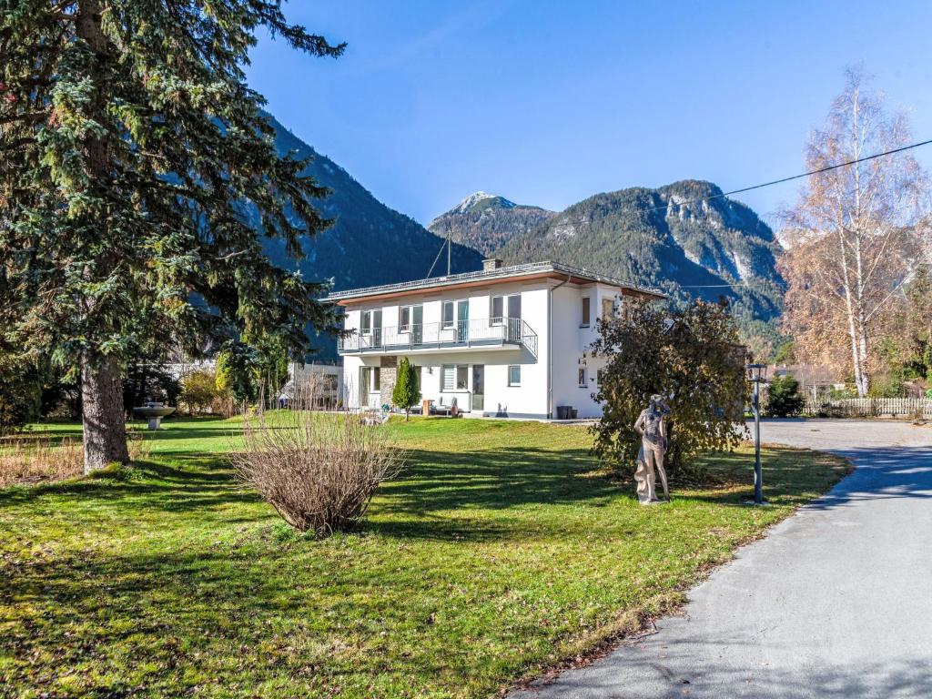 a white house with a mountain in the background at Villa Acereto by Interhome in Nassereith