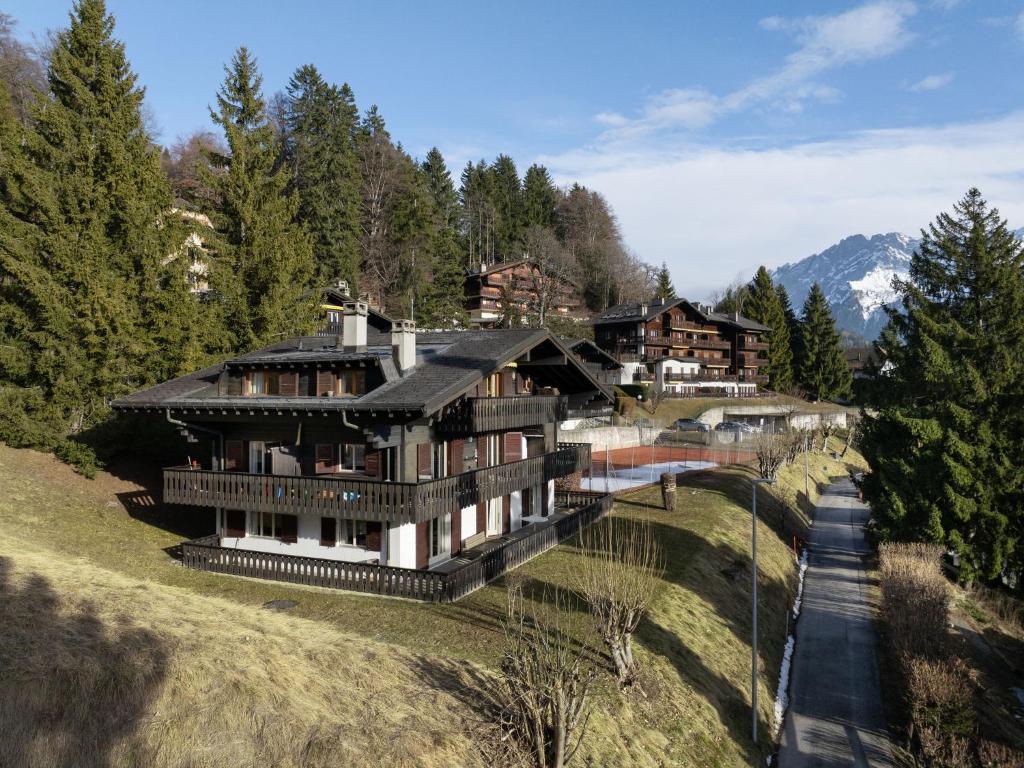 a large house in the middle of a forest at Apartment Regina D1 by Interhome in Arveyes
