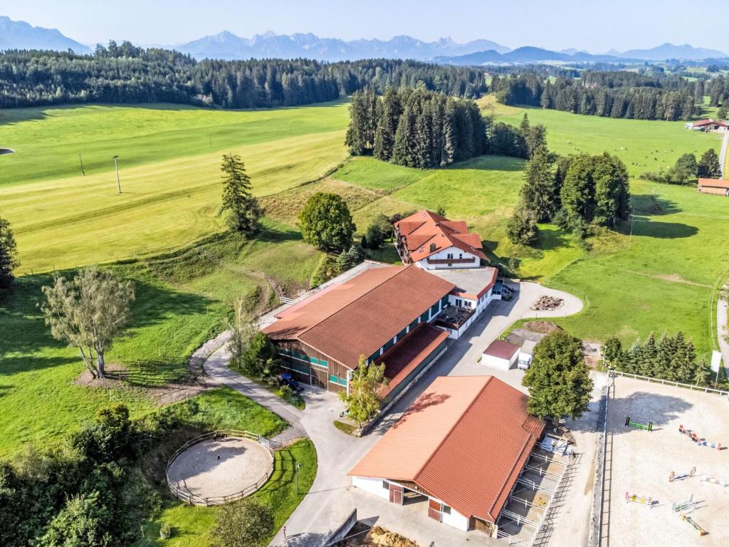 an overhead view of a building with a field and trees at Apartment Alpenlodge Breitenberg by Interhome in Lechbruck