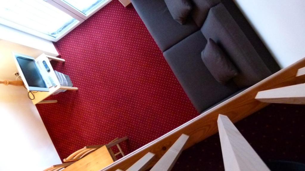TV a/nebo společenská místnost v ubytování Ferienwohnung Grischuna