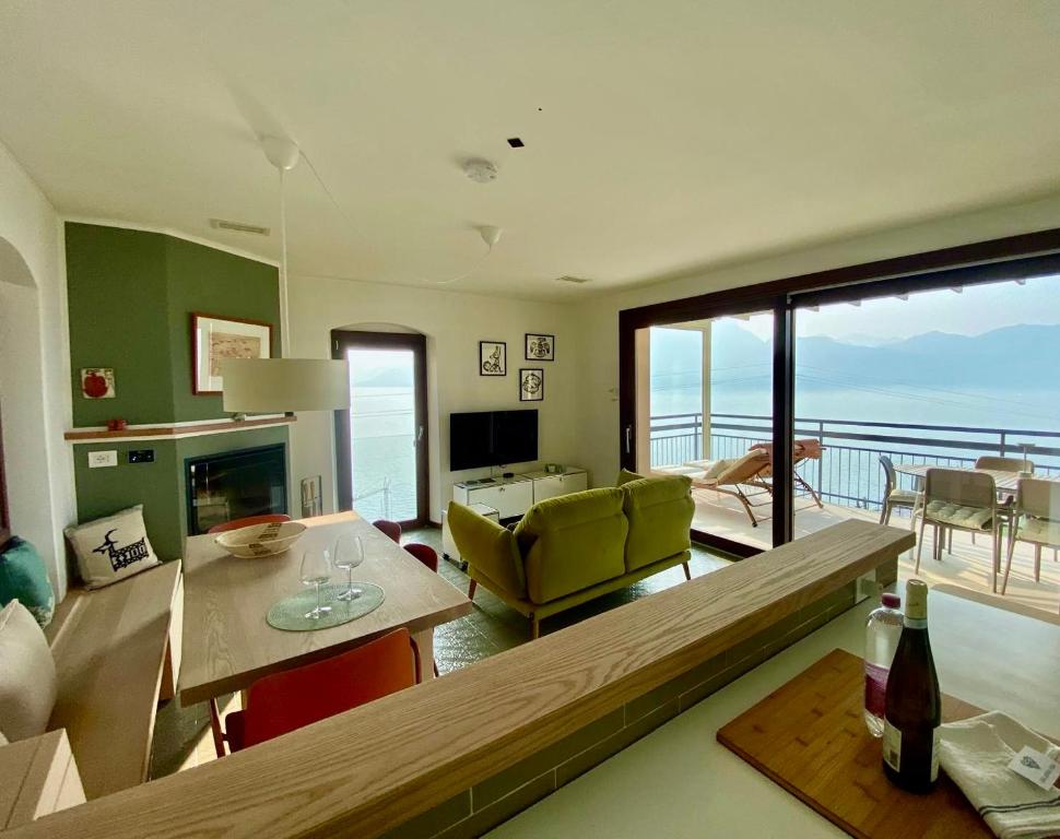 a living room with a view of the ocean at casa prima vista in Torri del Benaco