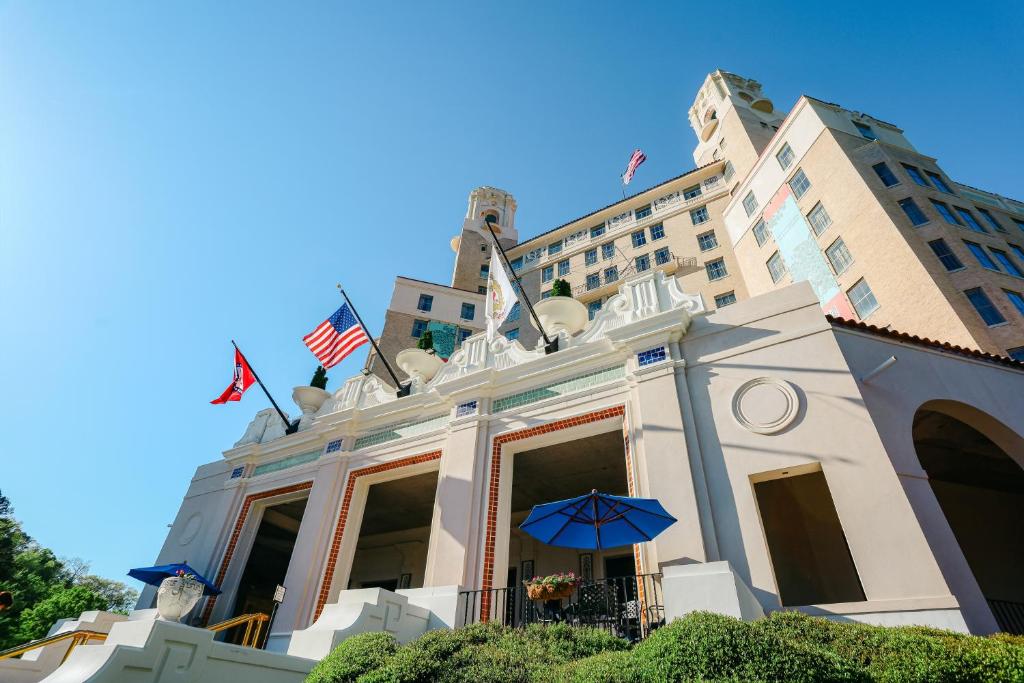 a building with a blue umbrella in front of it at Arlington Resort Hotel & Spa in Hot Springs