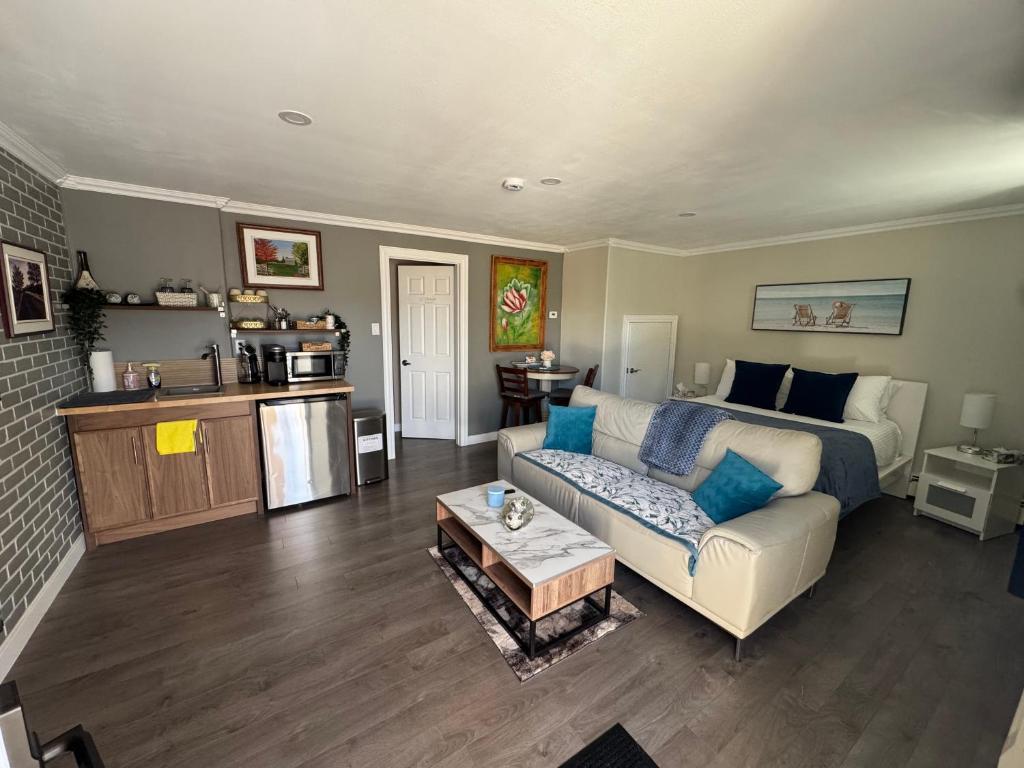 a living room with a couch and a table at Emmas place in Halifax