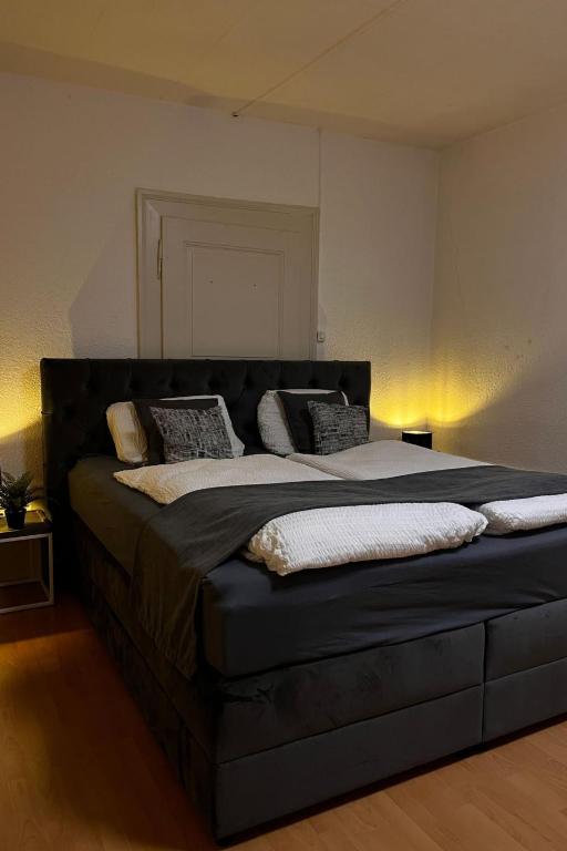 a bedroom with a large bed with pillows on it at Apartment Thun Relax Suite by Interhome in Thun