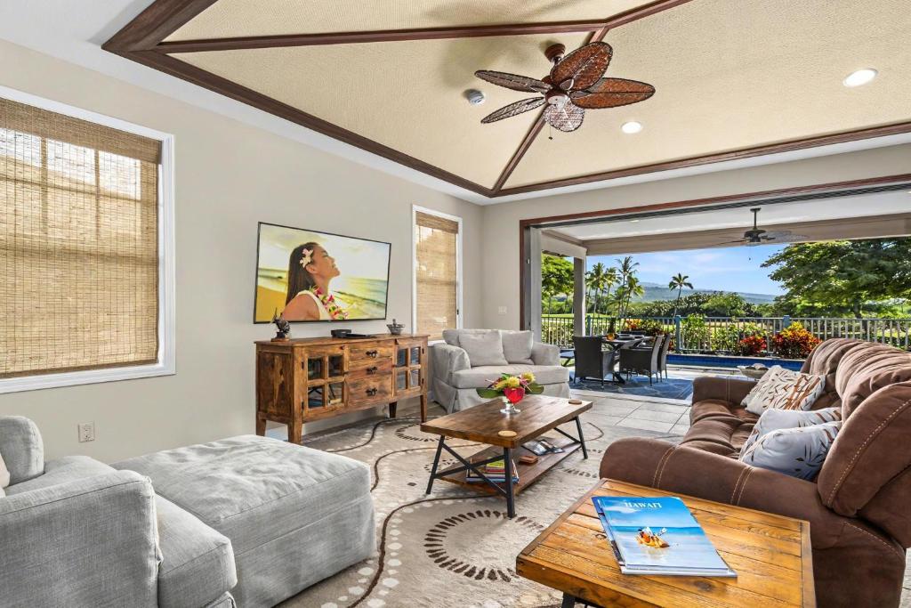 a living room with a couch and a table at Kona Blue Vacations Holua Kai in Kailua-Kona