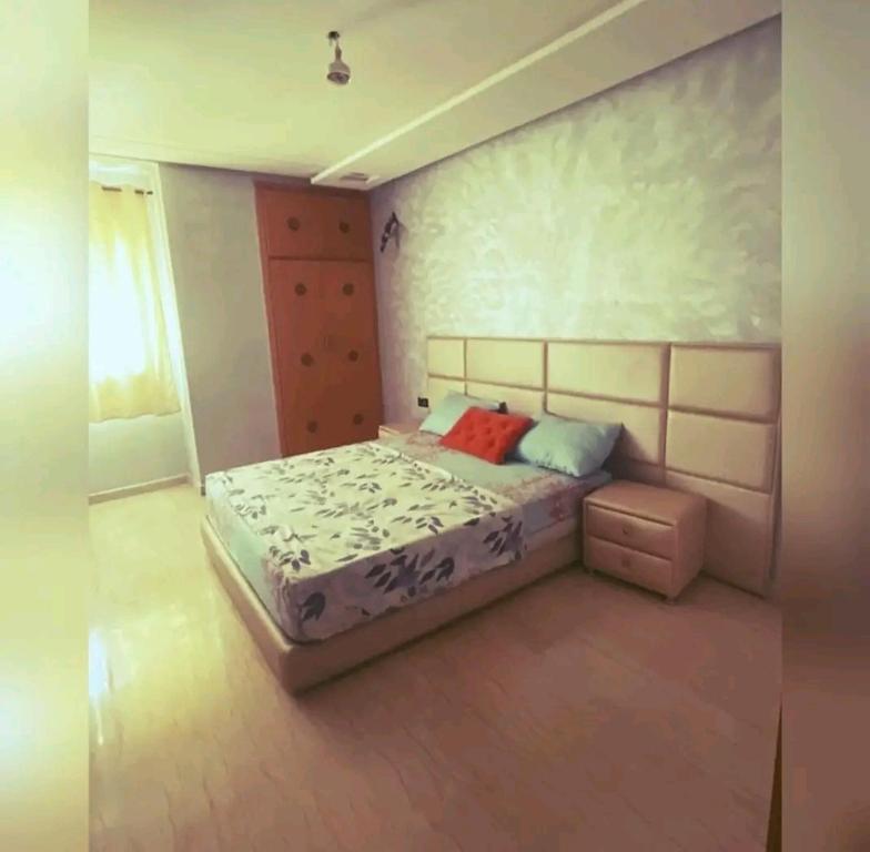 a bedroom with a bed in a room at إقامة حسن in Fez