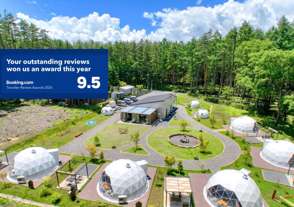 a rendering of a geodesic dome resort with a photo of a garden at HOSHIFULL DOME FUJI in Fujikawaguchiko