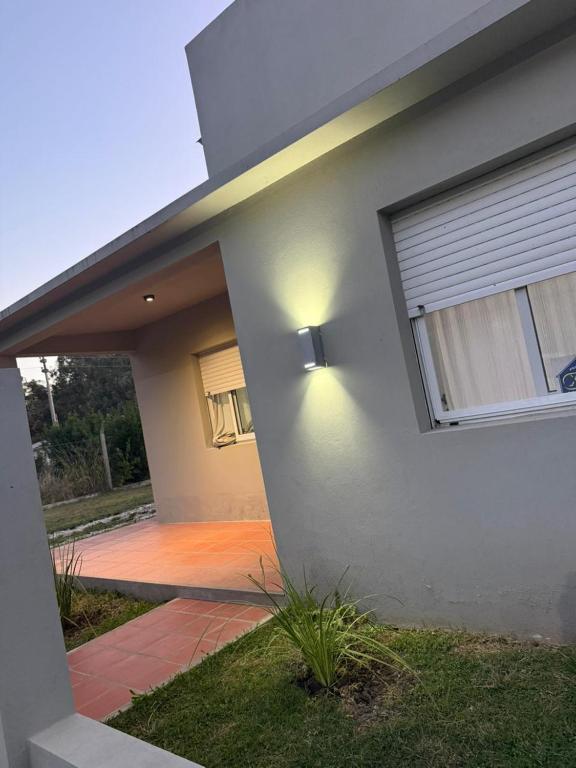 a house with a light on the side of it at Doña Mercedes in Verónica