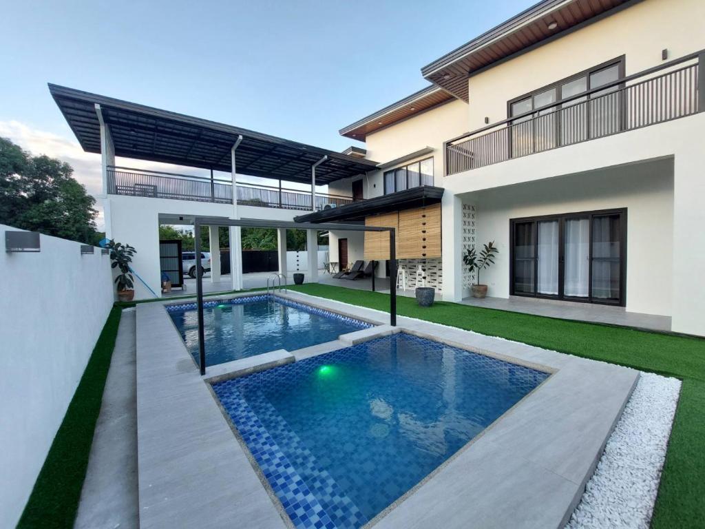 a swimming pool in the backyard of a house at Casa Marangle Private Villa in Mexico