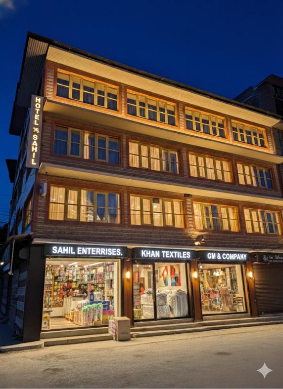 a building with a store in front of it at Hotel Sahil - City Center, LalChowk in Srinagar