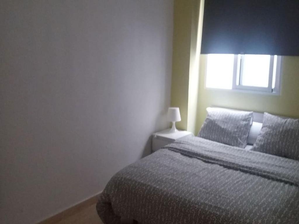 Posteľ alebo postele v izbe v ubytovaní Apartamento Ciudad de las Ciencias