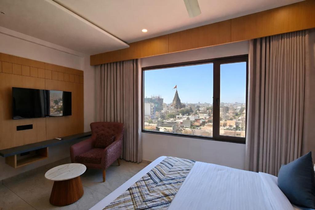 a hotel room with a view of a city at White Panda hotels Shree Radhe in Dwarka