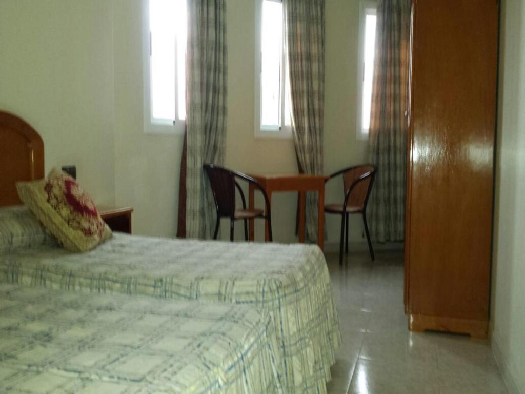 Postel nebo postele na pokoji v ubytování Motel Paris Dakar