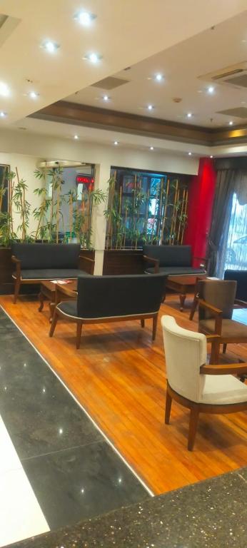 a room with ping pong tables and chairs at Vesta Fuar Otel in Konak