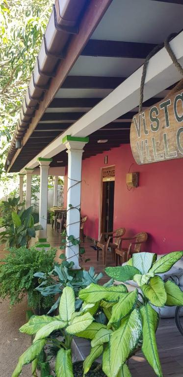 a building with a sign that reads visitor villa at Vista villa in Panama