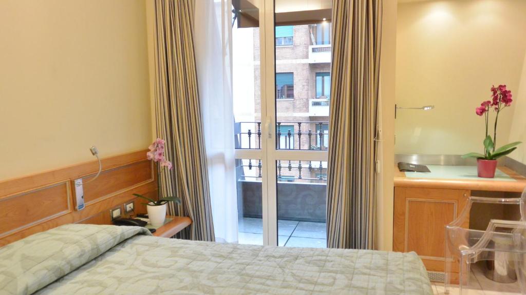 Postel nebo postele na pokoji v ubytování Hotel Sempione