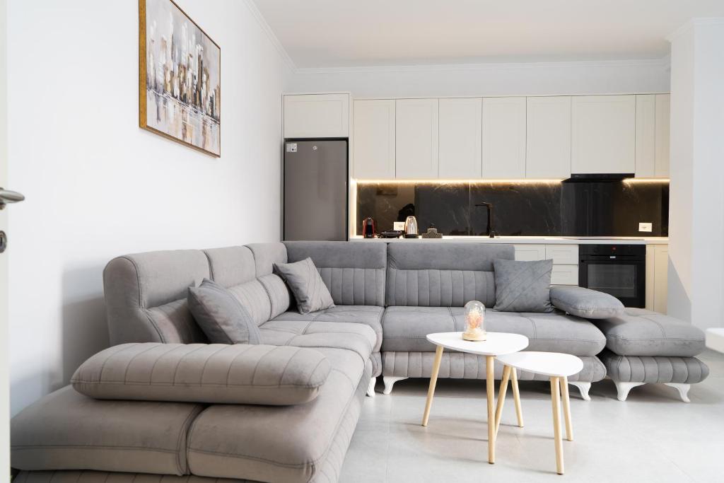 a living room with a couch and a table at Greca Apartments in Sauk