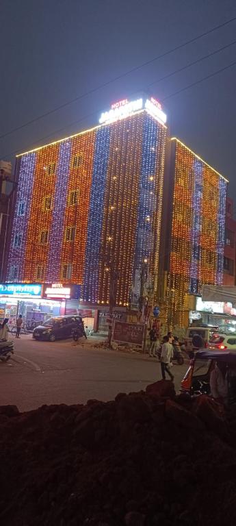 a large building with lights on top of it at night at HoTEL JAGAPATHI INTERNATIONAL in Vijayawāda