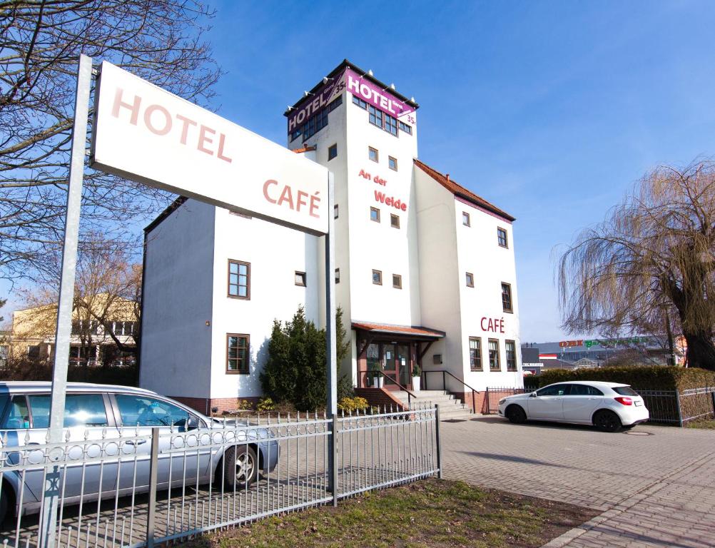 a hotel car parked in front of a building at Garni-Hotel An der Weide in Berlin