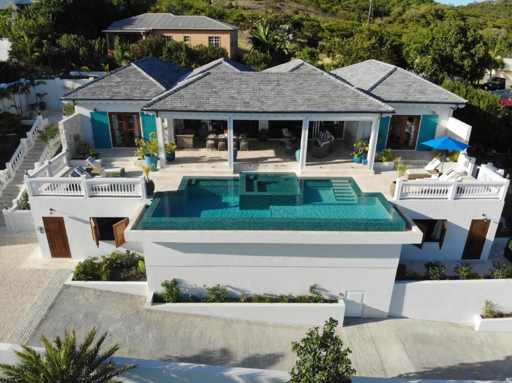 an aerial view of a house with a swimming pool at Tuckers Villa in Cobbs Cross