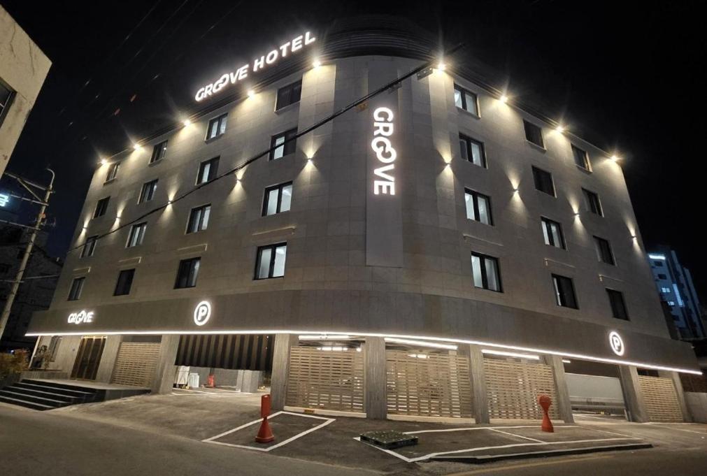 a building with lights on the side of it at 그루브 호텔 Groove Hotel in Jeonju