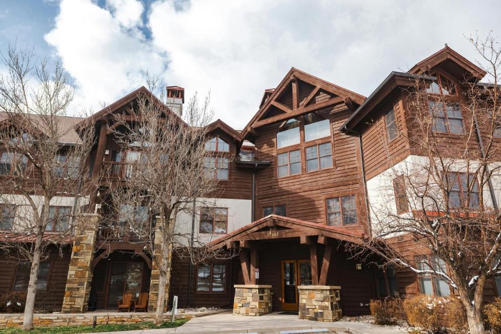 an exterior view of a large wooden house at Lodge at Brookside, A Vail Resorts Property in Avon