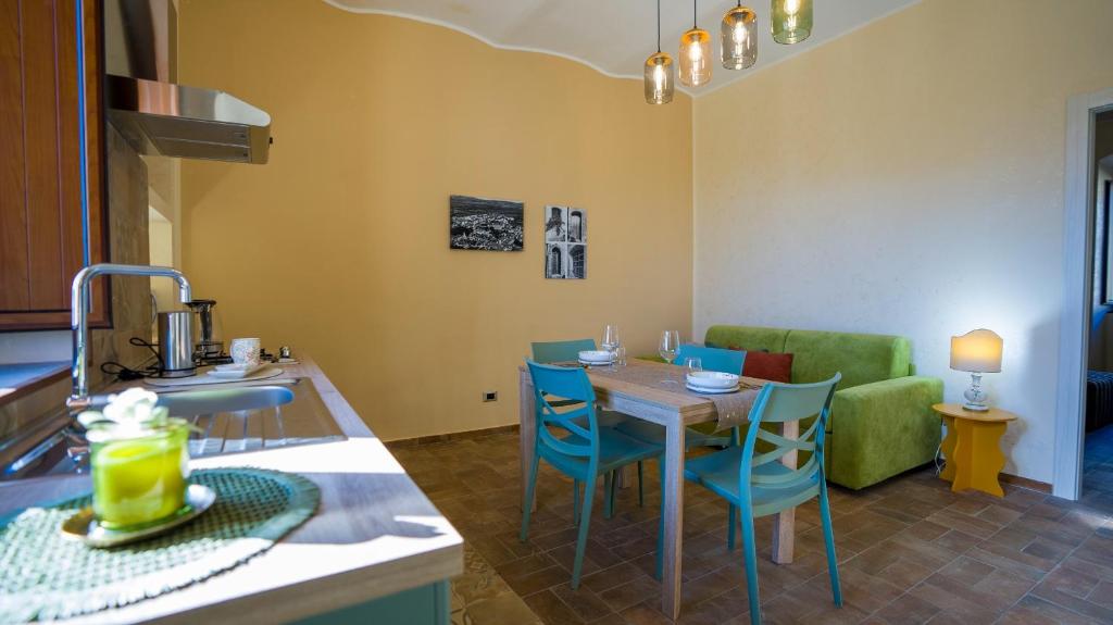 a kitchen and living room with a table and chairs at Risorta Ponente in Boiano