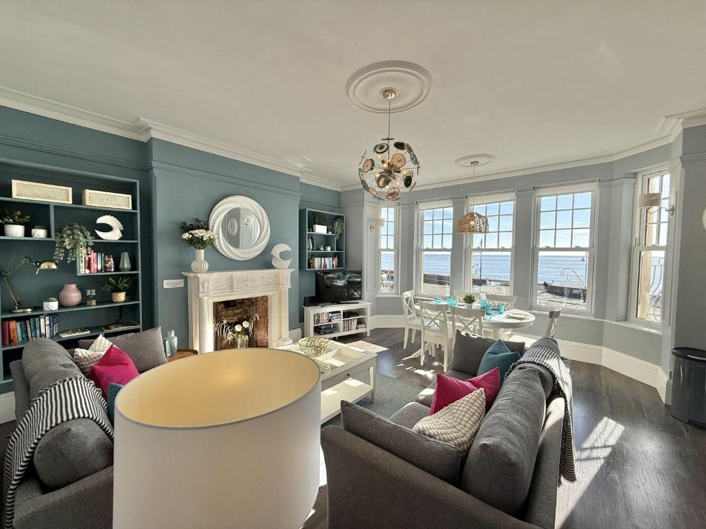 a living room with a couch and a table at The Eastleigh in Seaton