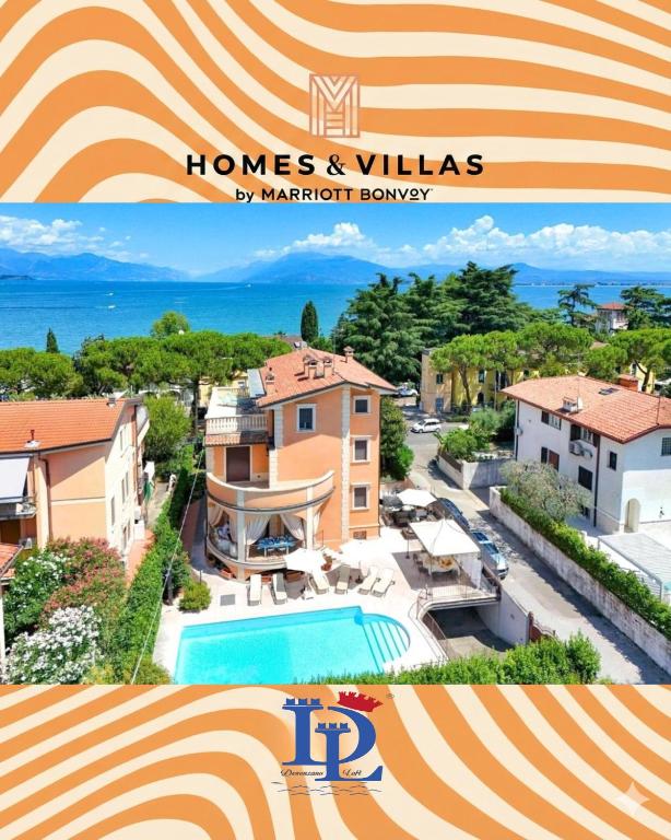 a view of a house and a swimming pool at Villa Bugatti Indipendent Villa ,lake view and private pool, DesenzanoLoft Official Partner Homes & Villas by Marriott Bonvoy in Desenzano del Garda