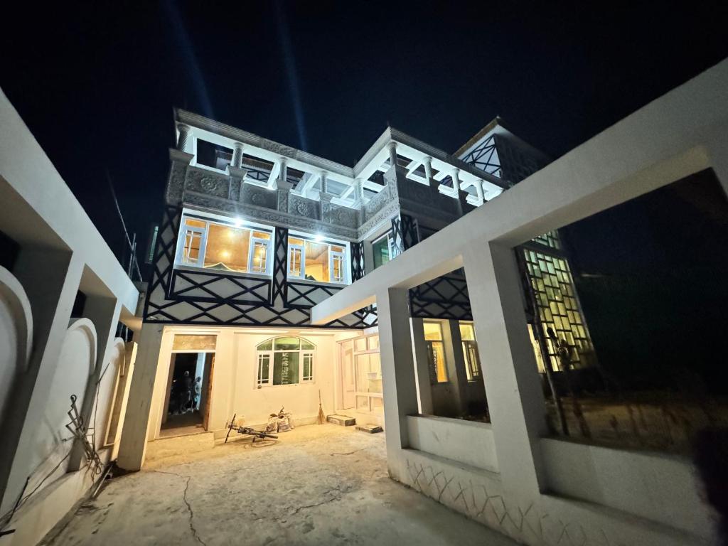 a view of a building at night at Impulse Homes in Srinagar