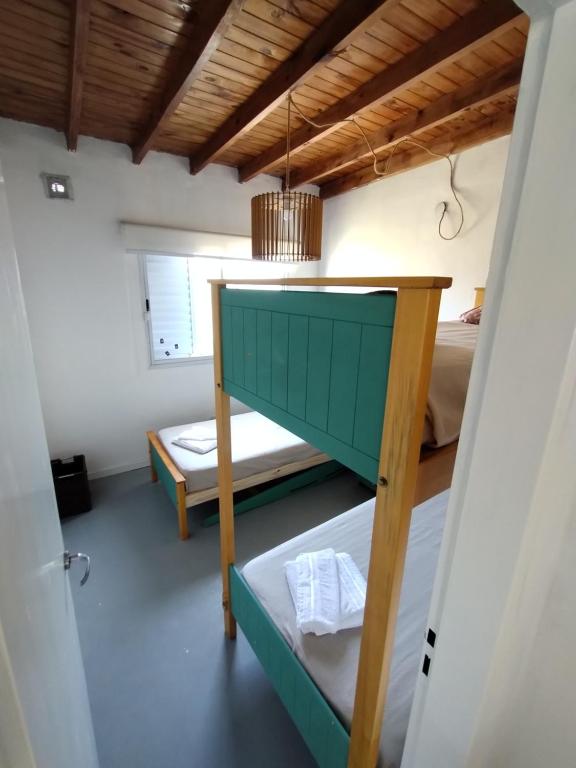 a small room with a bunk bed and a bunk bed at Casa Saavedra in Dolores