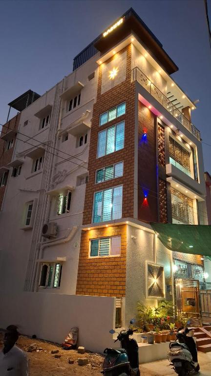 a building with motorcycles parked in front of it at Roshni Apartment - Ground Floor in Vishāram
