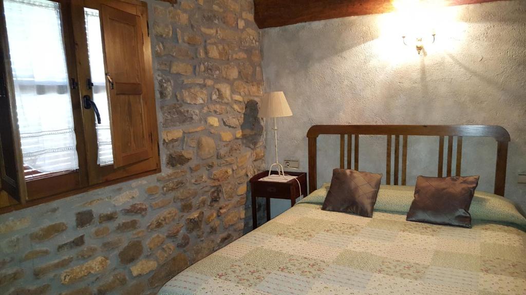 Postel nebo postele na pokoji v ubytování Apartamentos La Borda Castillon