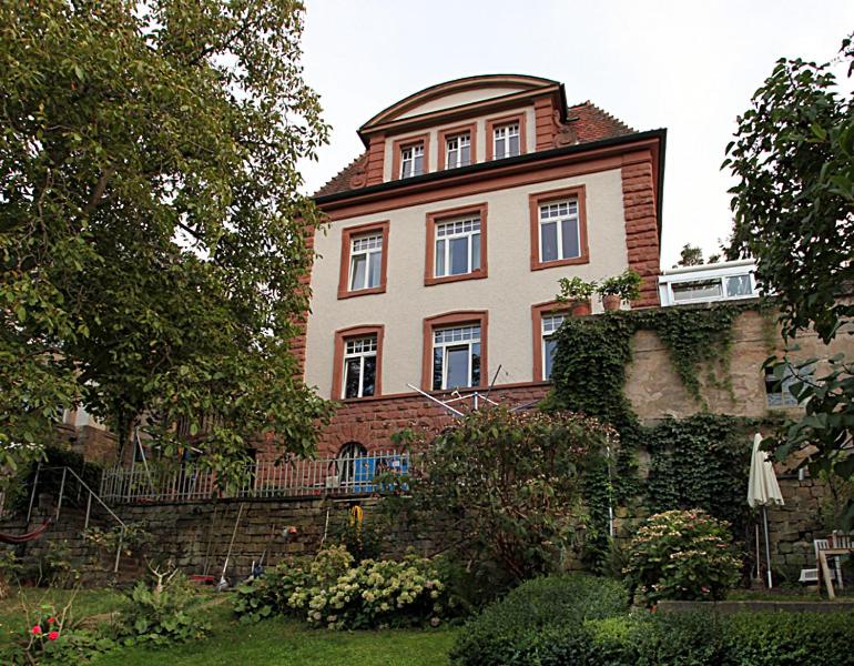 a large brick house on top of a building at Jugendstil Ferienwohnung Neustadt in Neustadt an der Weinstraße