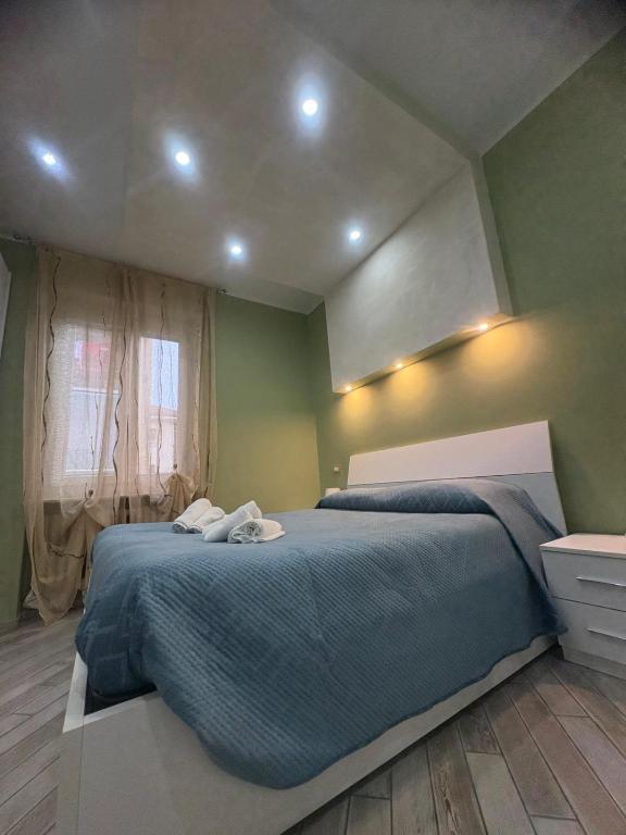 a bedroom with a bed with two white towels on it at La Concordia in Novi Ligure