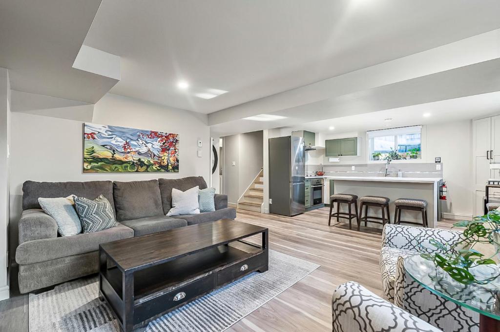 a living room with a couch and a table at Bright & Cozy Central Retreat in Calgary