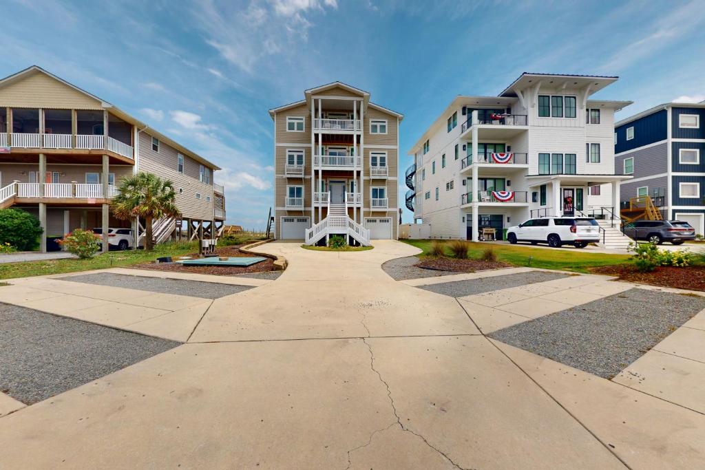 a walkway in front of some apartment buildings at NTB106 Scotch Bonnet Sunrise in North Topsail Beach