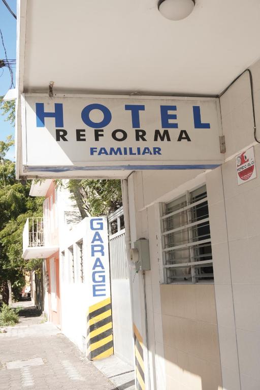 a sign for a hotel in front of a building at Hotel Reforma in Veracruz
