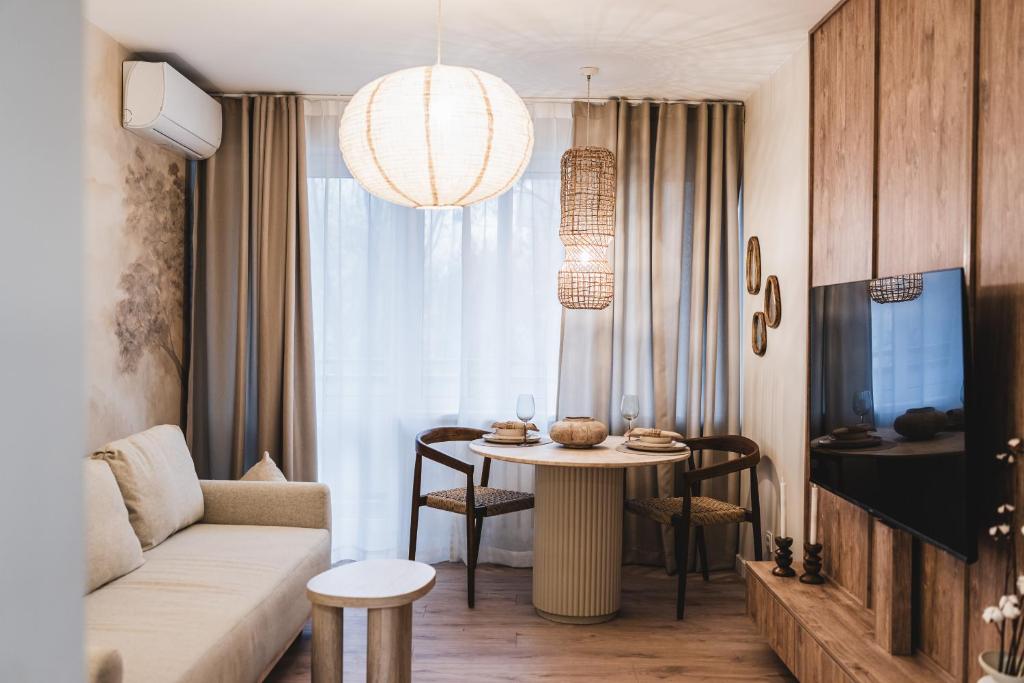 a living room with a couch and a table at Filomacka Przestrzeń in Toruń