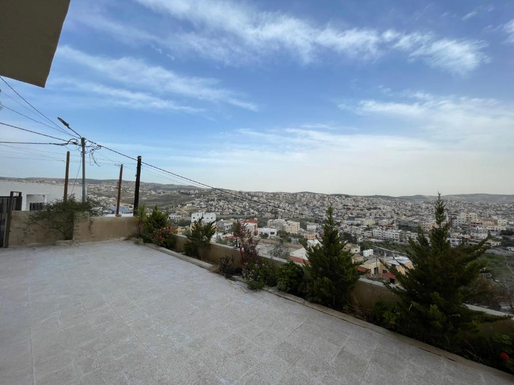 a view of a city from the roof of a house at Jerash Skyline in Jerash